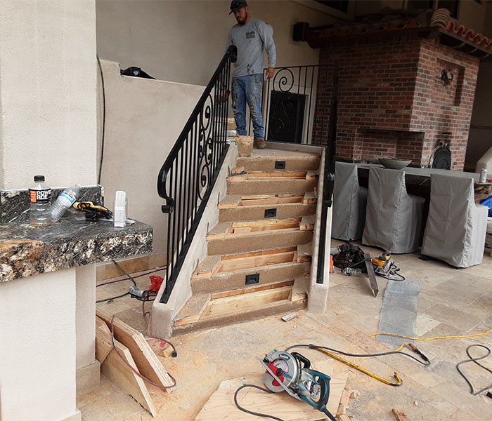Worker working on a wooden steps